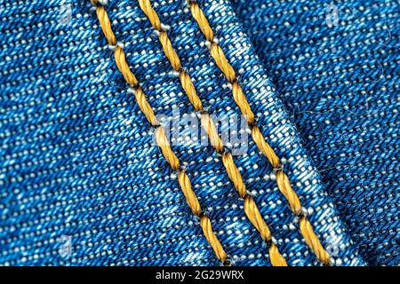 Genähte Naht des blauen Denim Jeans Nahaufnahme Hintergrund Stockfoto