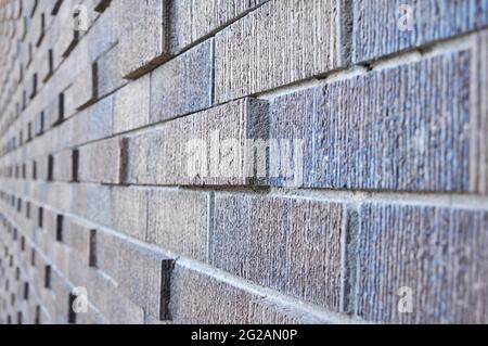 Seitenansicht der abstrakten Backsteinmauer - Hintergrund Stockfoto