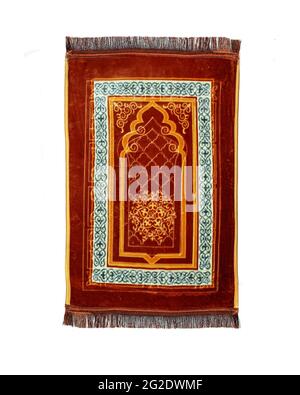 Seidig weiche islamische Gebetsmatte isoliert auf weißem Hintergrund, helles und dunkles Farbdesign, Stofffaden Stockfoto