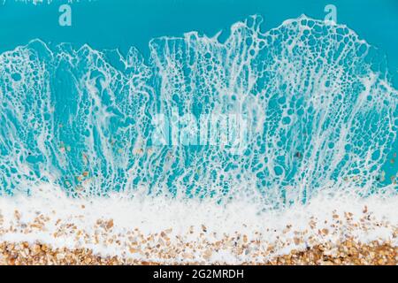 Kunstharz mit Meereswellen und Strand. Meereshintergrund aus Epoxidharz Kunst Stockfoto