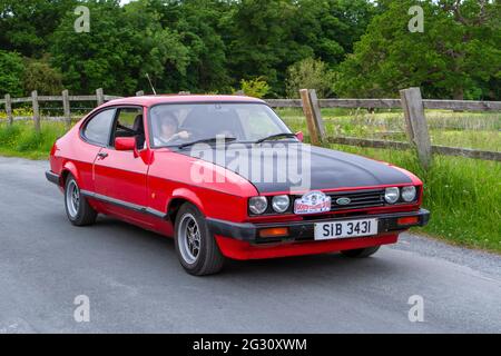 1986 80er Jahre roter Ford Capri 1993ccm Benzin-two​-plus-zwei Coupé beim 58. Jährlichen Manchester to Blackpool Vintage & Classic Car Run. Stockfoto