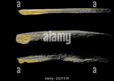 Sammlung von verschiedenen Handzeichnungen goldene Farbe Pinselstriche auf schwarzem Hintergrund isoliert Stockfoto