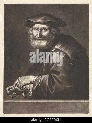 Lächelnder Mann mit einer Münze in der Hand. Ein lächelnder Mann mit einer Geschwindigkeit in der Hand. Er trägt einen Hut. Stockfoto