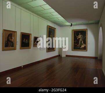 Ecke eines Raumes mit Gemälden, darunter eines von Napoleon und eines von seinem Bruder Lodewijk Napoleon; Ausstellung. Gegen die Rückwand Kaiser Napoleon I. im Krönungstor, 2. Dezember 1804, von François Pascal Simon (Baron) Gérard. Lodewijk Napoleon (1778-1846), König von Holland von 1806 bis 1810, von Charles Howard Hodges. Stockfoto
