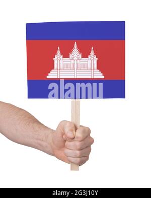 Hand hält kleine Karte - Flagge von Kambodscha Stockfoto