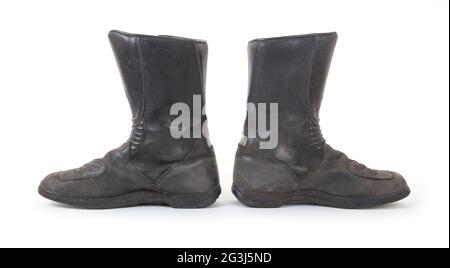 Alte Motorradstiefel Stockfoto