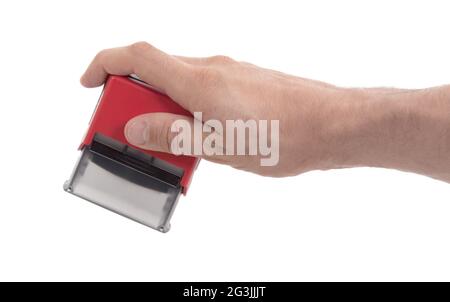 Plastikstempel in der Hand, isoliert Stockfoto