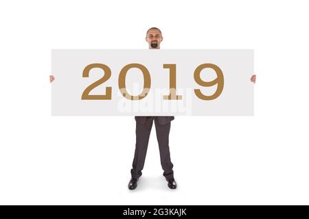 Lächelnder Geschäftsmann mit einer wirklich großen leeren Karte - 2019 Stockfoto