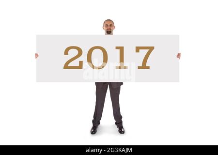 Lächelnder Geschäftsmann mit einer wirklich großen leeren Karte - 2017 Stockfoto