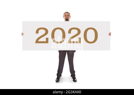 Lächelnder Geschäftsmann mit einer wirklich großen leeren Karte - 2020 Stockfoto