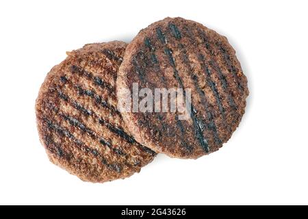 Zwei geröstete Burger-Patties auf weißem Hintergrund Stockfoto