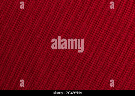 Rot gestrickt Wollstoff Hintergrund Stockfoto