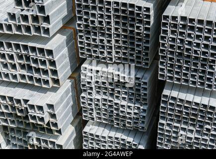 Bent metal profile channel stored at the street. Stockfoto