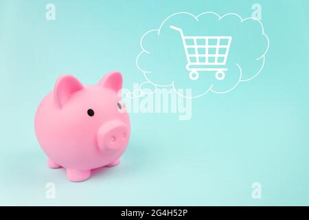 Rosa Sparschwein mit Wagen digitale Hologramm in Wolke dachte über seinem Kopf auf blauem Hintergrund Stockfoto