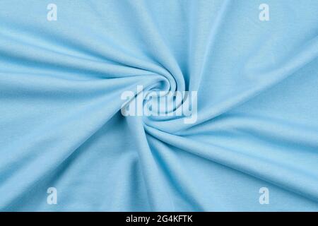 Hintergrund aus hellblauem einfarbigen Baumwollstoff. Stockfoto