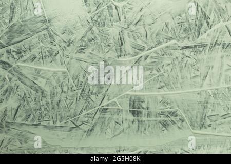 Strukturiertes Muster auf der Oberfläche und Spuren von frischer Farbe. Abstrakte Wandstruktur. Hintergrund der Kunst. Wandtextur Stockfoto