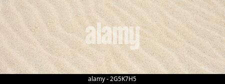Sanddünen und Strand Textur Hintergrund. Sommerstrandkonzept Stockfoto