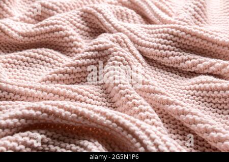 Struktur aus rosa Strickstoff, Nahaufnahme Stockfoto