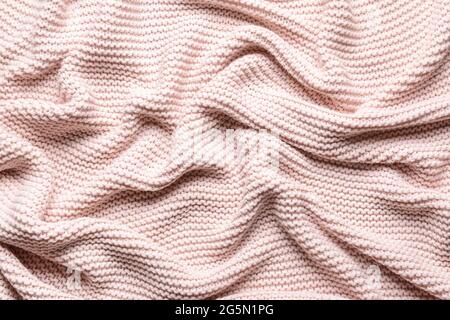 Struktur aus rosa Strickstoff, Nahaufnahme Stockfoto