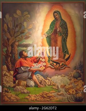 Wunder des Tepeyac Gemäldes von Jungfrau Maria Unsere Lieben Frau von Guadalupe, das vor dem indigenen mexikanischen St. Juan Diego auftaucht Stockfoto