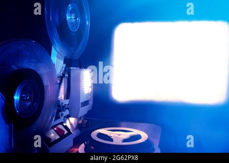 Toned Photo of Old Film Projector showing the Film in Dusk Stockfoto