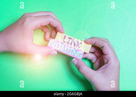 Handschriftschild Link Building. Word für SEO Term Exchange Links Akquise Hyperlinks indiziert Brainstorming Probleme und Lösungen fragen relevant Stockfoto