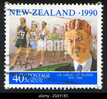 NEUSEELAND - UM 1990: Stempel gedruckt von Neuseeland, zeigt Runner Jack Lovelock, um 1990 Stockfoto