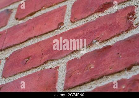 Rote Backsteinmauer, Backsteinmuster, roter Backsteinhintergrund, Nahaufnahme Stockfoto