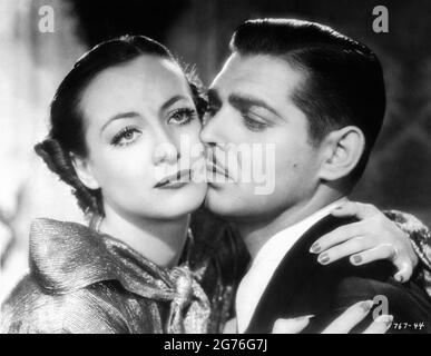 JOAN CRAWFORD und CLARK GABLE in CHAINED 1934 Regisseur CLARENCE BROWN Story Edgar Selwyn Drehbuch John Lee Mahin kleiden Gilbert Adrian Metro Goldwyn Mayer Stockfoto