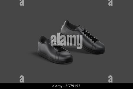 Blanker, schwarzer Leder-Sneaker mit Schnürsenkelmockup, dunklem Hintergrund, 3d-Rendering. Leere, atmungsaktive Sportschuhe im Modell, Seitenansicht. Klar leger fo Stockfoto