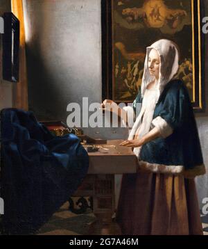 Vermeer. 'Woman Holding a Balance' von Johannes Vermeer (1632-1675), Öl auf Leinwand, c. 1664 Stockfoto