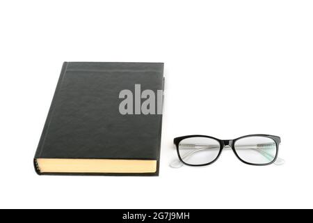 Buch und Brille isoliert auf weißem Hintergrund. Alle Objekte sind schwarz. Freier Speicherplatz für Text. Stockfoto