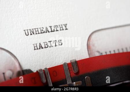 Ungesunde Gewohnheiten Phrase geschrieben mit einer Schreibmaschine. Stockfoto