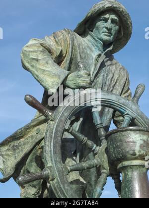 Bronzestatue eines Matrosen mit Rad Stockfoto