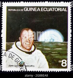 ÄQUATORIALGUINEA - UM 1978: Eine in Äquatorialguinea gedruckte Marke zeigt John Glenn, USA Astronaut, um 1978 Stockfoto