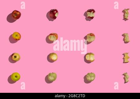 Essen Äpfel kreative Muster. Vier Arten von Äpfeln, die gebissen werden. Stockfoto