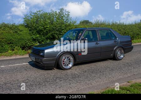 1990s 90s Neunzigers grey VW Volkswagen GTI 1781cc Benziner auf dem Weg zur Capesthorne Hall classic July Car Show, Ceshire, UK Stockfoto