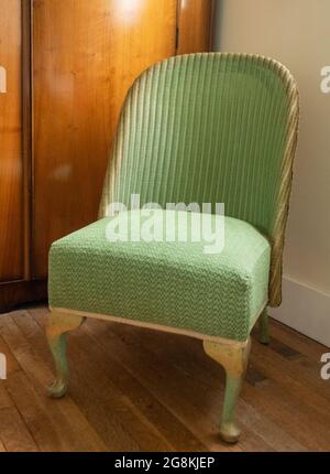 Original Vintage Green Lloyd Loom Korbstuhl aus Rattan. Stockfoto