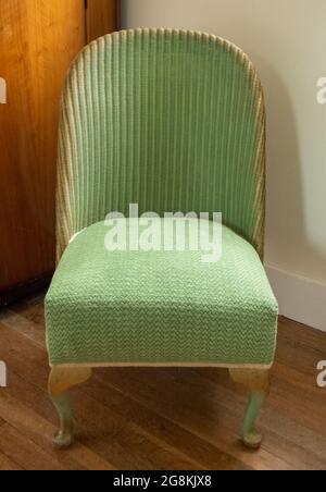 Original Vintage Green Lloyd Loom Korbstuhl aus Rattan. Stockfoto