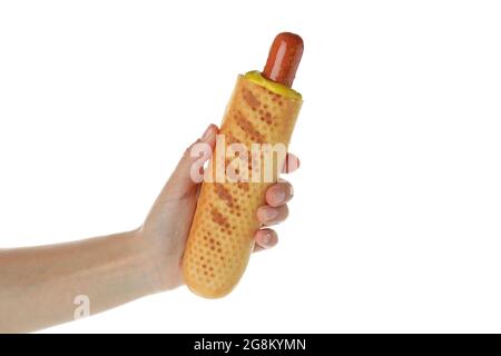 Weibliche Hand hält französisch Hot Dog, isoliert auf weißem Hintergrund Stockfoto