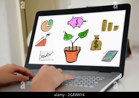 Hands on a Laptop with screen showing Investment concept Stockfoto