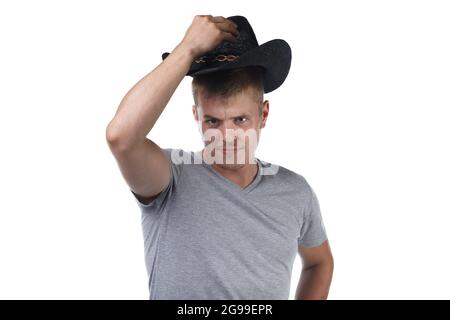 Foto eines jungen Borstenmannes im Cowboyhut Stockfoto