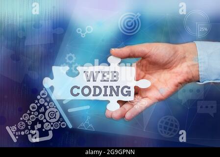 Textunterschrift mit Web-Codierung. Konzept bedeutet ein System von Symbolen und Regeln verwendet, um Anweisungen Hand halten Jigsaw Puzzle Stück darstellen Stockfoto