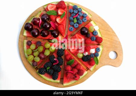 Sweet watermelon pizza with berries. Stockfoto
