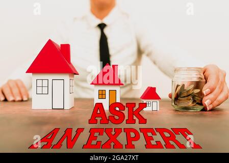 Textunterschrift mit „Fragen Sie einen Experten“. Business-Ansatz Befragen Sie jemanden, der über Kenntnisse über etwas oder kenntnisreiche verschiedene Pläne für Häuser hat Stockfoto