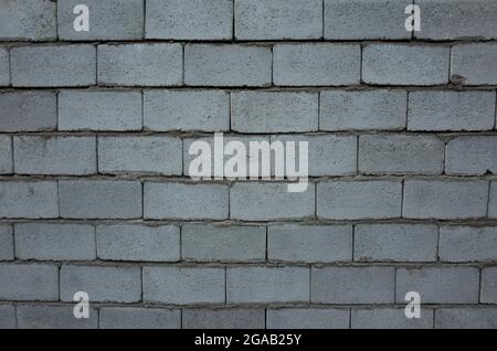 FOTO von Mauerziegeln in der Straße Stockfoto
