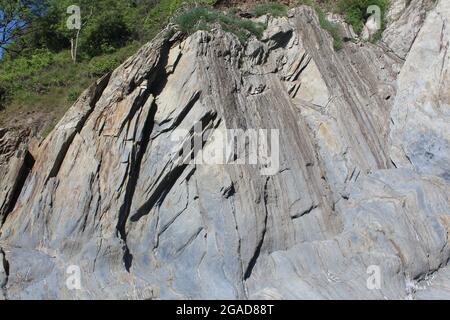 Felsen Kies Sand Muschel Strand Stockfoto