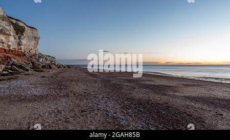 Abendlicht am Hunstanton Klippen in Norfolk, England, Großbritannien Stockfoto