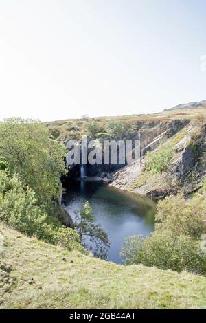 Überfluteter Steinbruch von Torver Beck in der Nähe von Torver High Common, Lake District Cumbria England Stockfoto