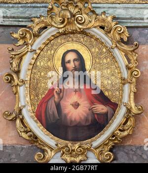WIEN, AUSTIRA - 24. JUNI 2021: Das Herzbild Jesu Christi aus der St. Gertrude Pfarrkirche von einem unbekannten Künstler aus dem Jahr 19. Jh. Stockfoto